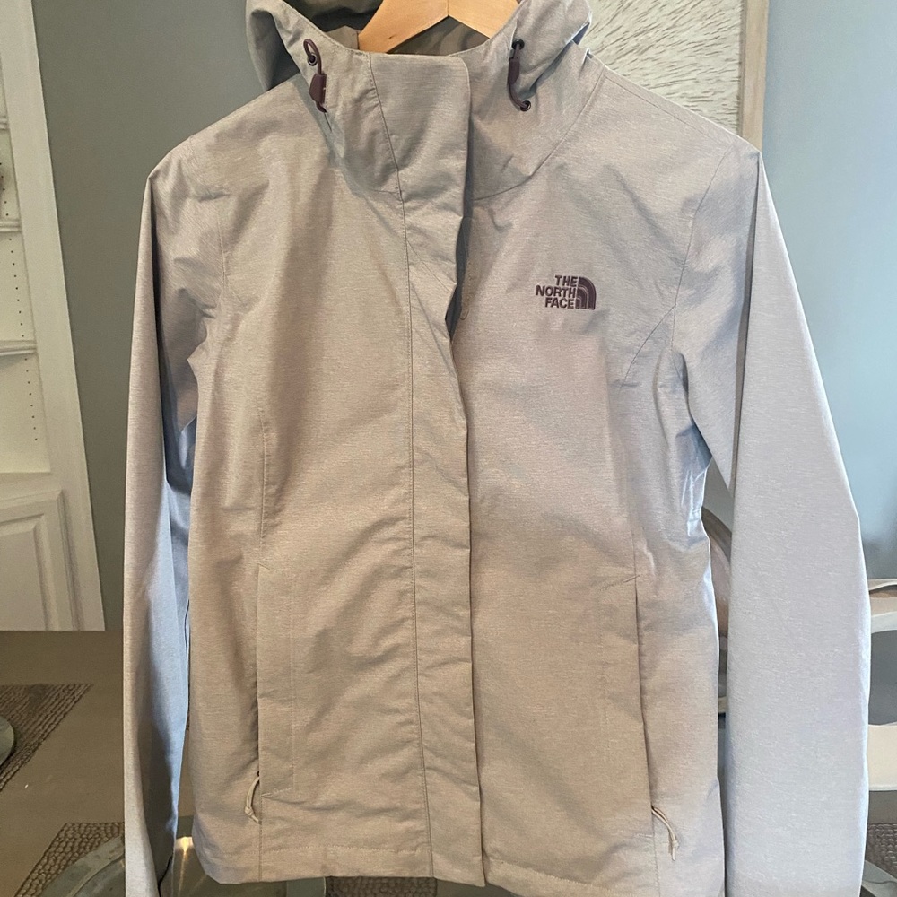 Northface light weight hooded  jacket waterproof gray in color .